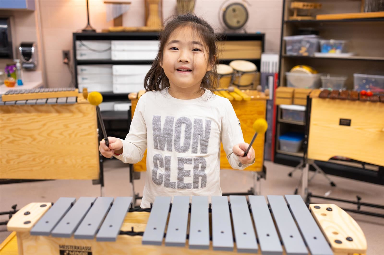 Student playing a musical instrument